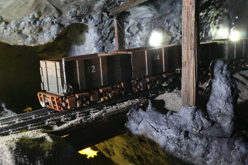 A line of mine trolleys in a mine scene